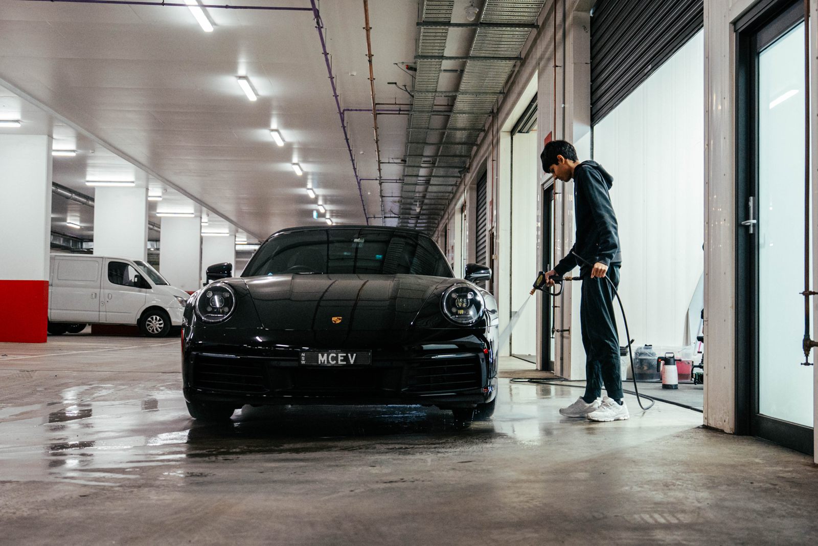 Pressure washing a black Porsche