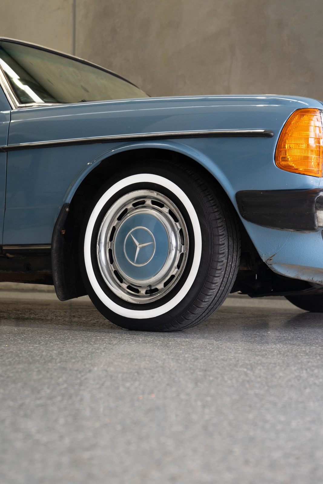Classic baby blue Mercedes with whitewall tyres